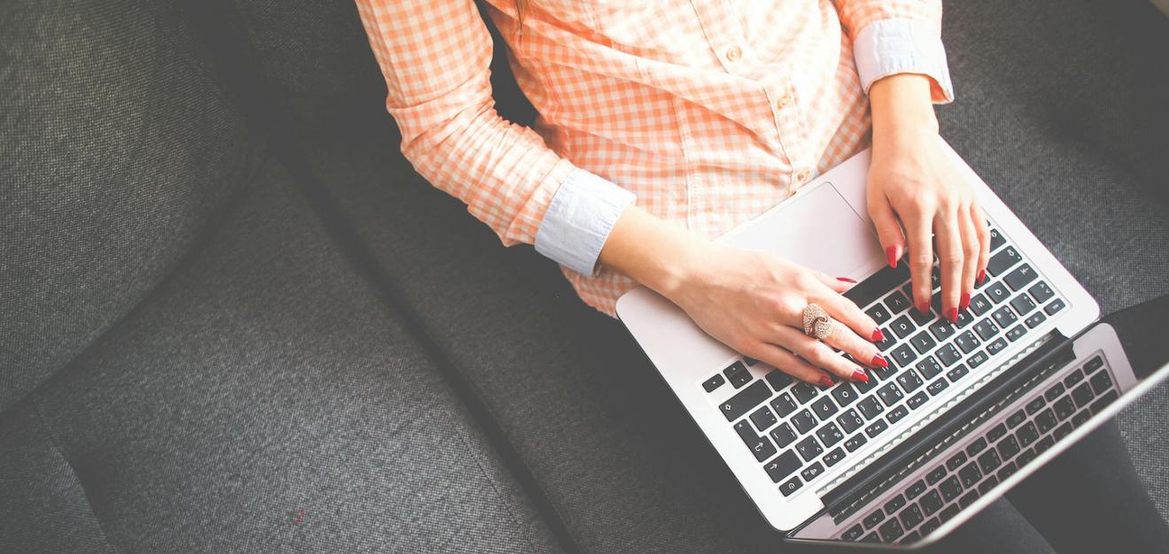 Hands typing on a computer, representing the application process for Scionics careers.